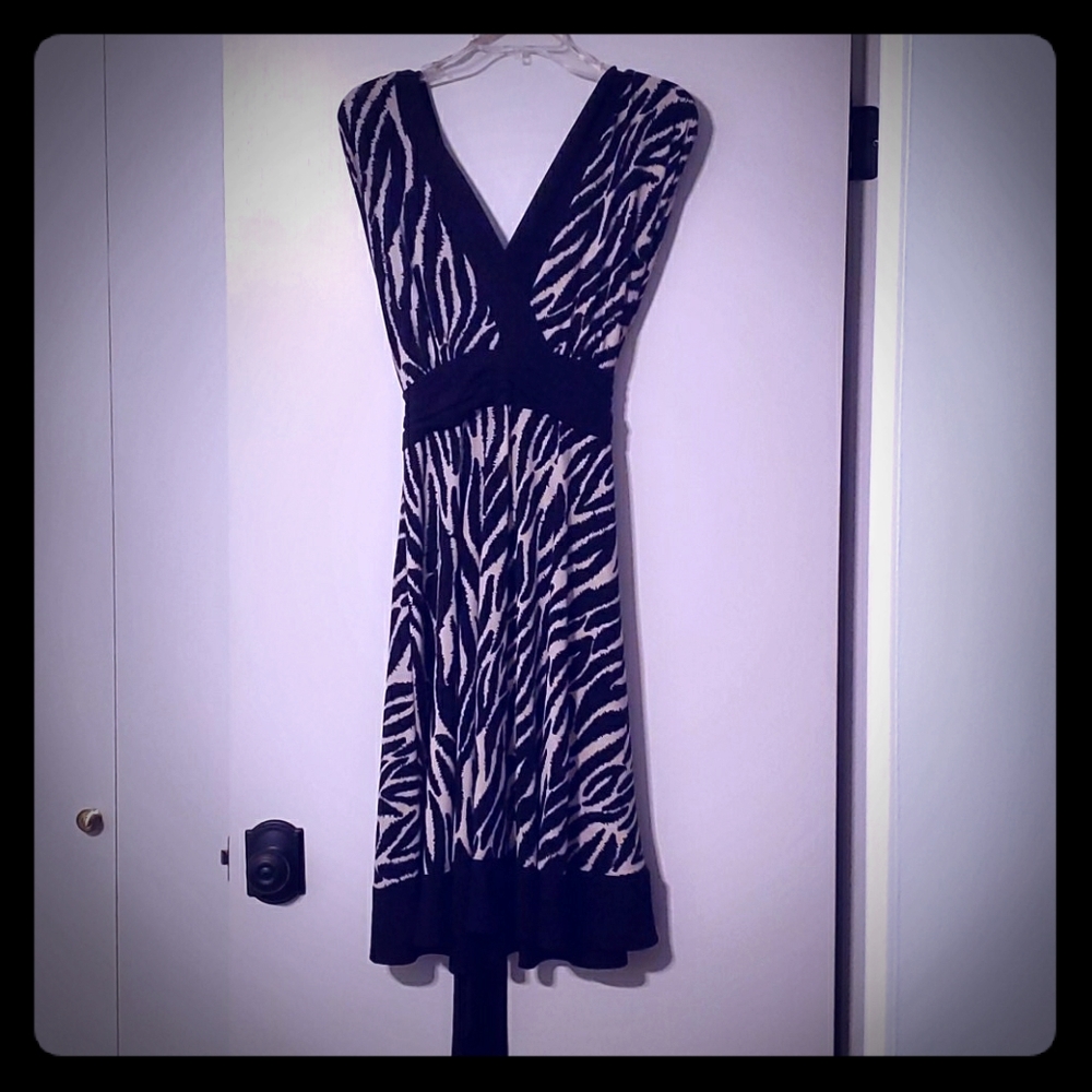 Striking black and tan dress with V neck and back